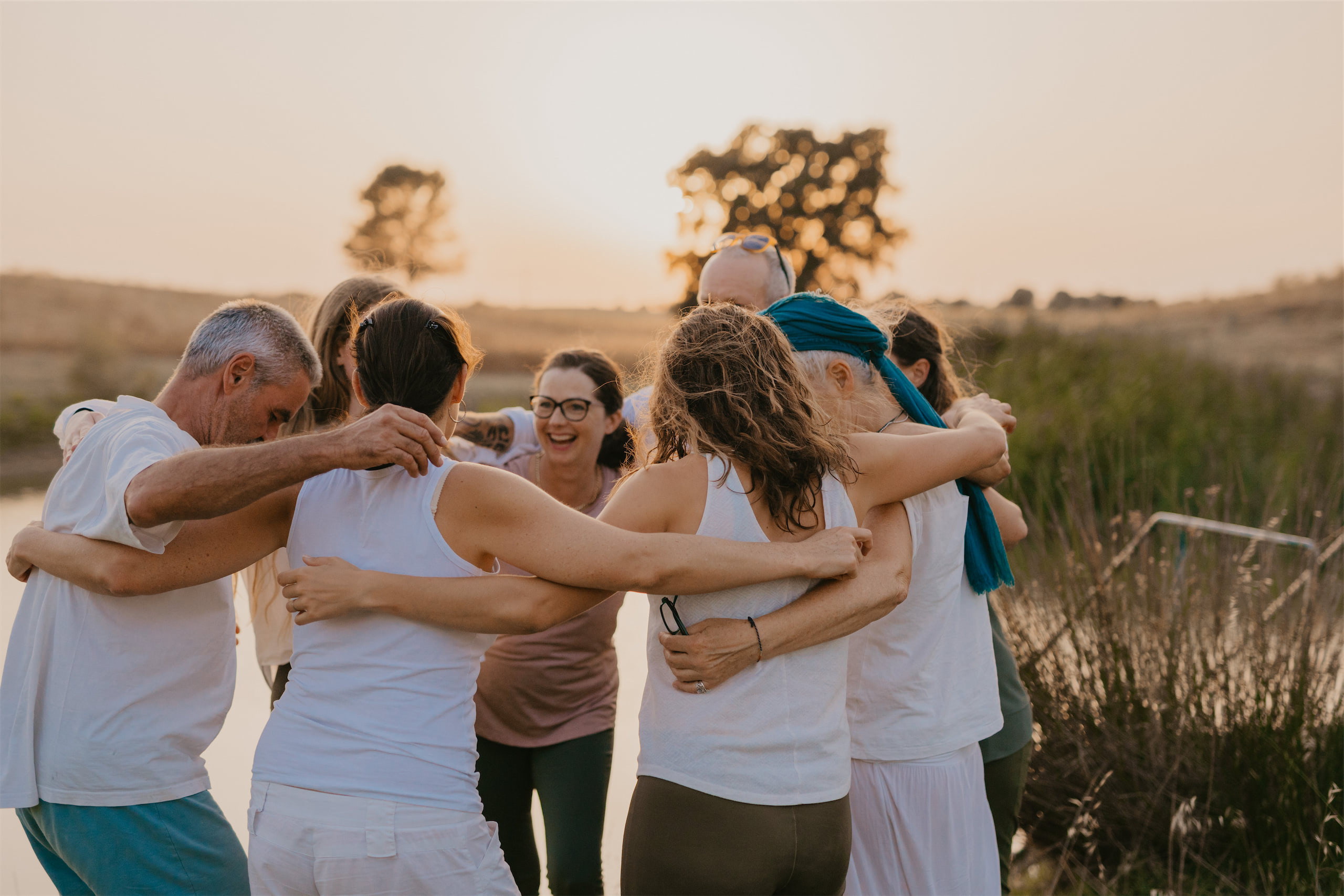 Group hug by the pond